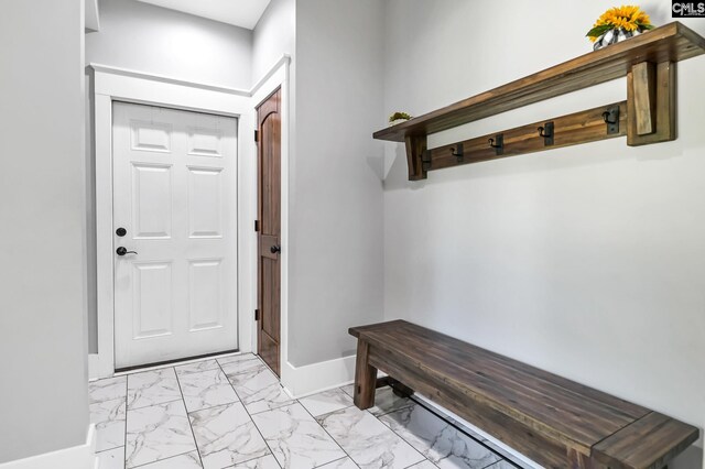 mudroom featuring baseboards and marble finish floor
