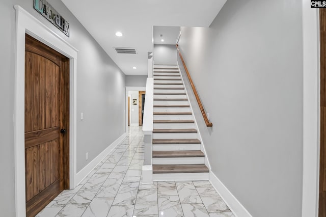 stairs with baseboards, marble finish floor, recessed lighting, and visible vents