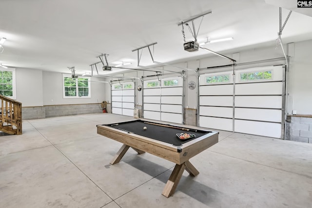 recreation room featuring billiards, a garage, and concrete flooring