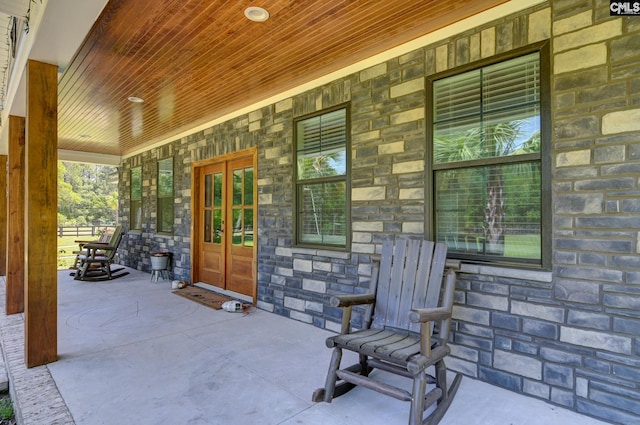 view of patio / terrace featuring french doors and covered porch