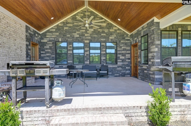 view of patio with covered porch, ceiling fan, an outdoor living space, and grilling area
