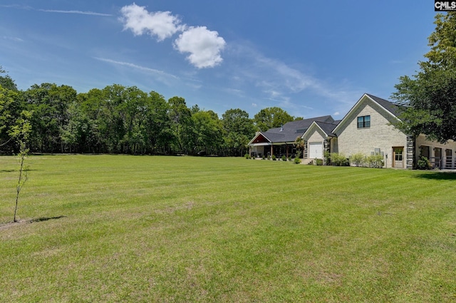 view of yard featuring a garage