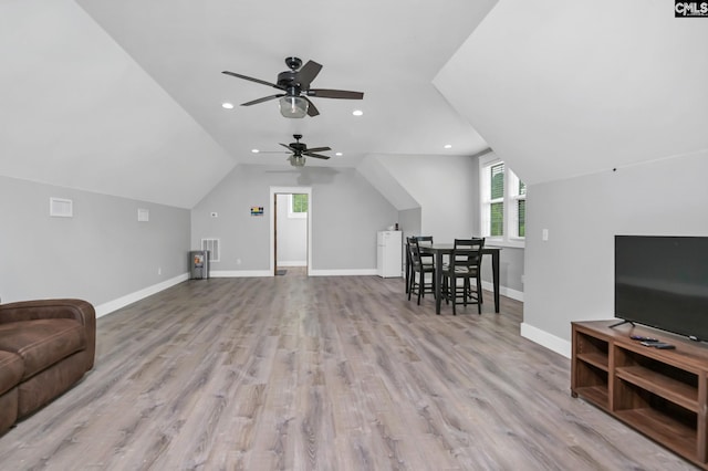 living area with wood finished floors, baseboards, ceiling fan, vaulted ceiling, and recessed lighting