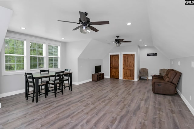 interior space featuring recessed lighting, baseboards, ceiling fan, vaulted ceiling, and wood finished floors
