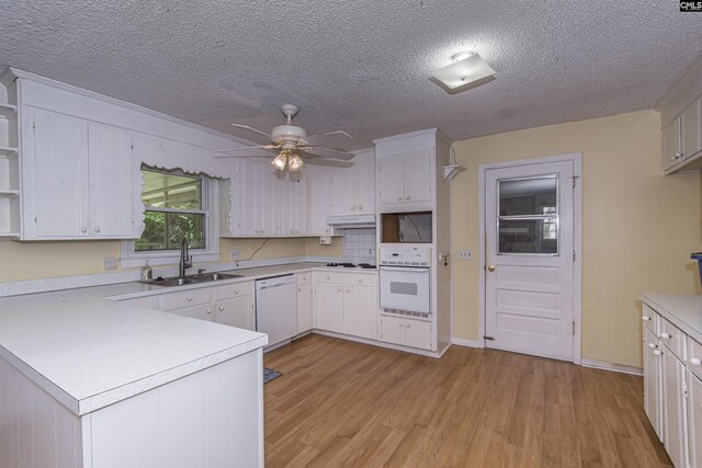 406 White Falls Dr, Columbia, SC 29212 - kitchen featuring open shelves, a peninsula, white appliances, light countertops, and a sink