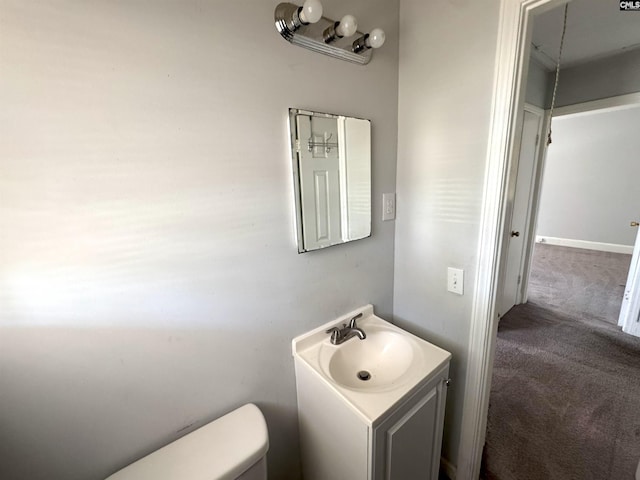 bathroom with toilet and vanity