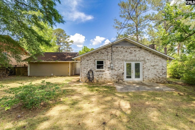 1916 Chandler Ave, Columbia, SC 29210 - back of house featuring fence, brick siding, a chimney, french doors, and a patio