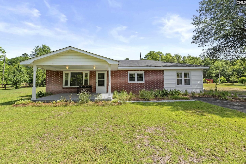 4517 Festival Trail Rd, Wagener, SC 29164 - single story home with brick siding and a front yard