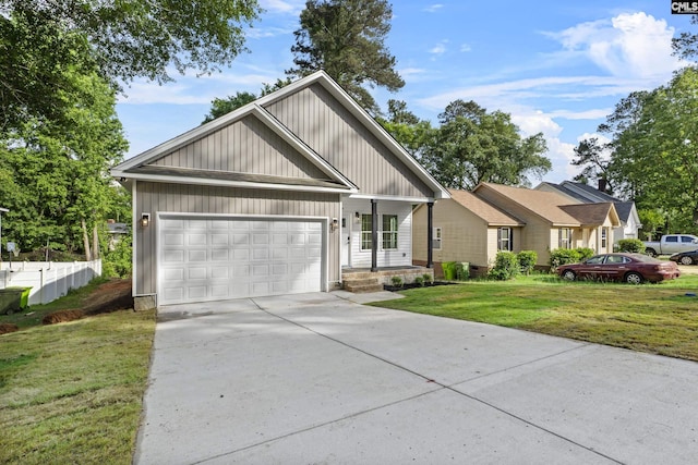 view of front facade with an attached garage, concrete driveway, and a front lawn