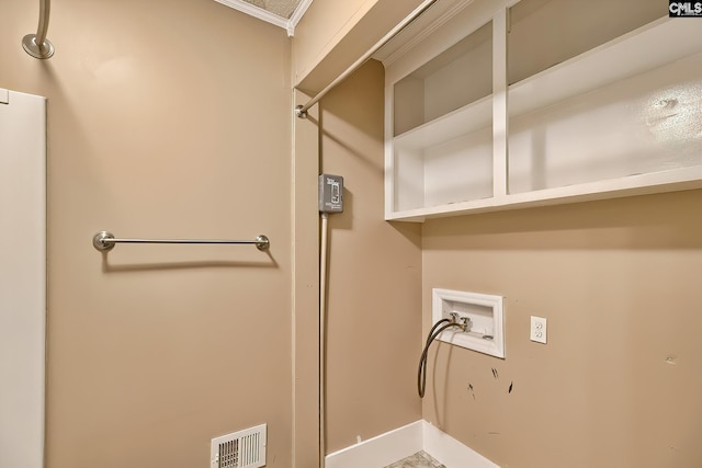 clothes washing area featuring visible vents, laundry area, crown molding, baseboards, and washer hookup
