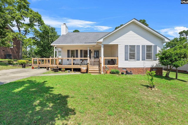 rear view of property with a lawn, crawl space, and a chimney