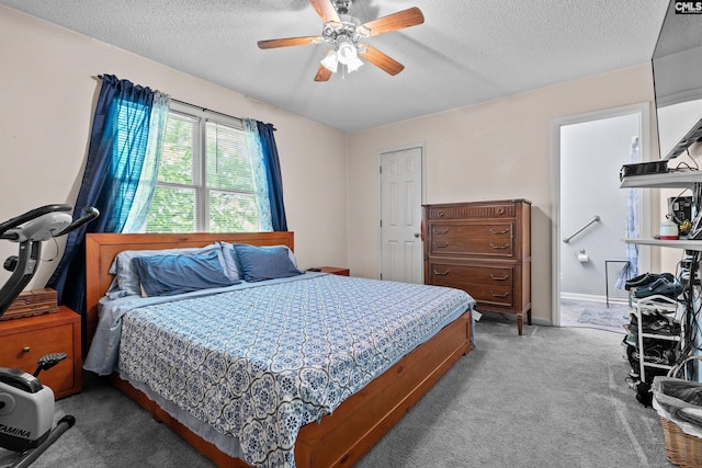 carpeted bedroom with a textured ceiling and ceiling fan