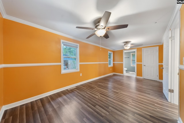 interior space featuring crown molding, baseboards, dark wood-style floors, and a ceiling fan