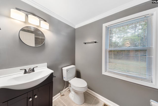 half bathroom with toilet, vanity, ornamental molding, tile patterned flooring, and baseboards