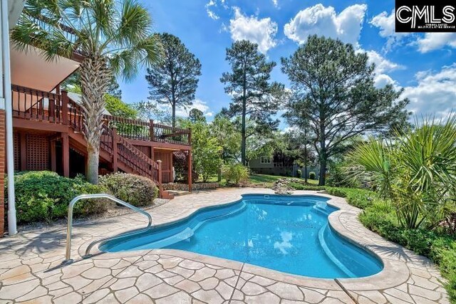 121 Cove View Dr, Irmo, SC 29063 - pool featuring a patio area, a wooden deck, and stairway