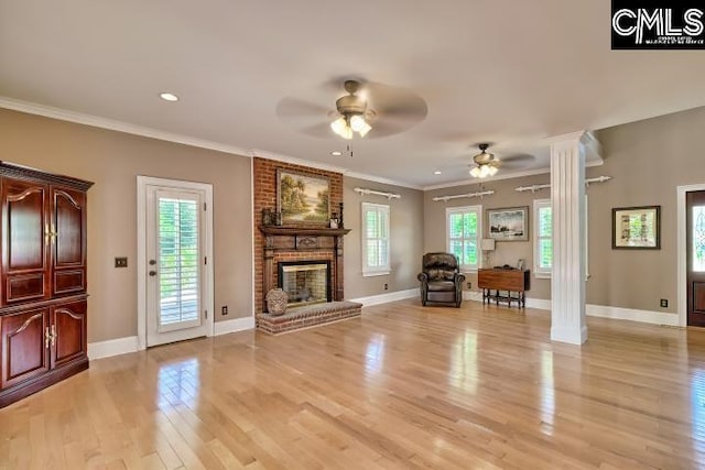 121 Cove View Dr, Irmo, SC 29063 - unfurnished living room with decorative columns, a fireplace, light wood-style floors, baseboards, and ceiling fan
