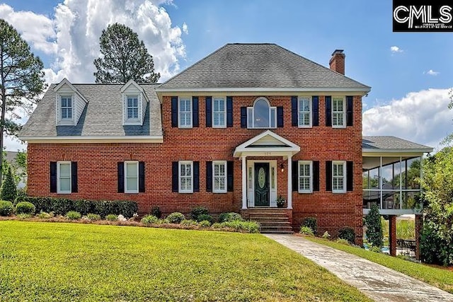 121 Cove View Dr, Irmo, SC 29063 - colonial inspired home featuring brick siding, a front yard, and a chimney