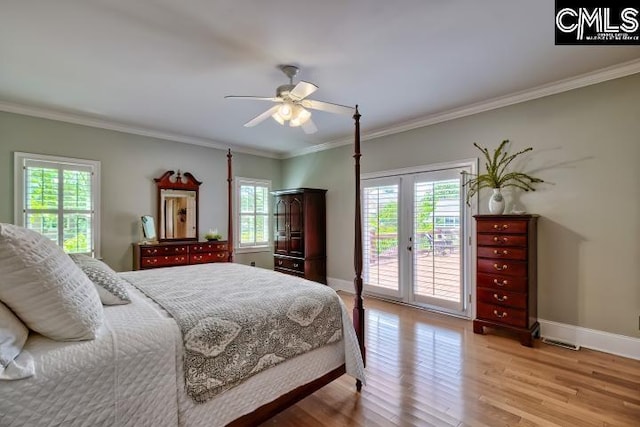 121 Cove View Dr, Irmo, SC 29063 - bedroom with baseboards, multiple windows, ornamental molding, and access to exterior