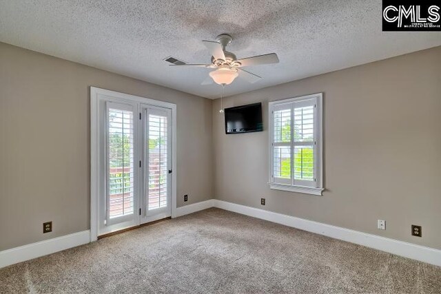 121 Cove View Dr, Irmo, SC 29063 - carpeted spare room with baseboards, a ceiling fan, and a textured ceiling