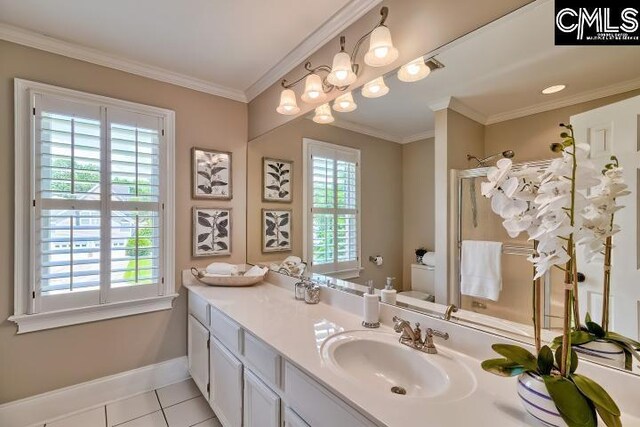 121 Cove View Dr, Irmo, SC 29063 - full bath with a shower stall, vanity, tile patterned floors, baseboards, and toilet