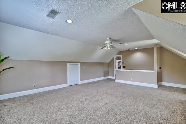 121 Cove View Dr, Irmo, SC 29063 - additional living space featuring a ceiling fan, a textured ceiling, visible vents, carpet floors, and lofted ceiling