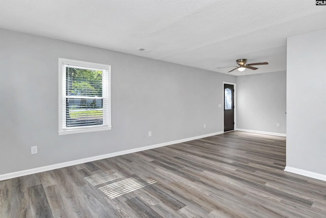 2723 Dubard St, Columbia, SC 29204 - empty room featuring a healthy amount of sunlight, baseboards, a ceiling fan, and wood finished floors