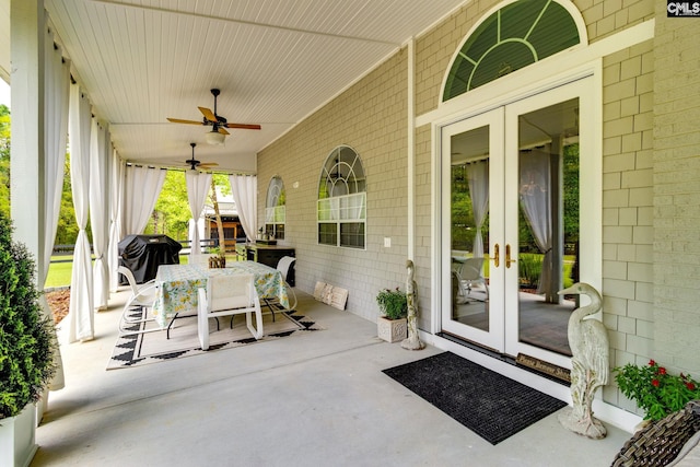 view of patio / terrace with ceiling fan, french doors, and outdoor dining space