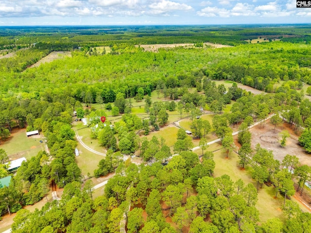 bird's eye view featuring a forest view