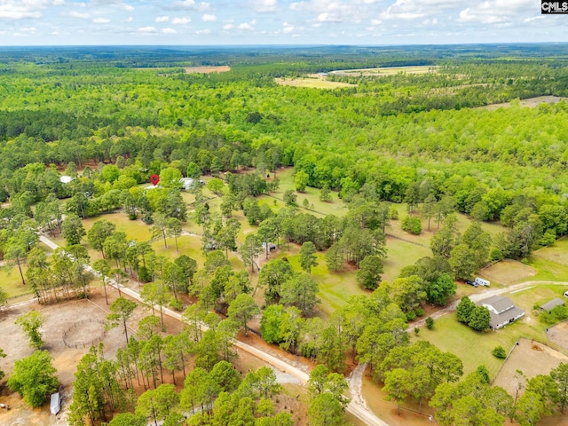 aerial view featuring a view of trees