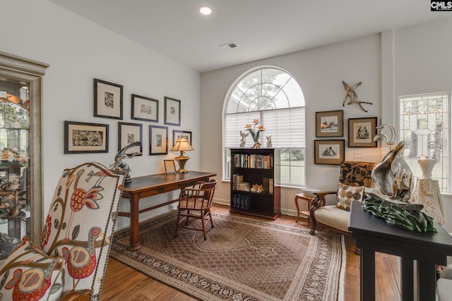interior space with visible vents, wood finished floors, baseboards, and recessed lighting