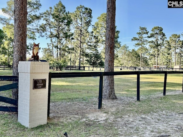 view of gate featuring fence