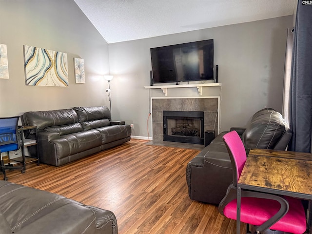 10 Mystic Way Dr, Columbia, SC 29229 - living room featuring wood finished floors, lofted ceiling, a fireplace, and baseboards