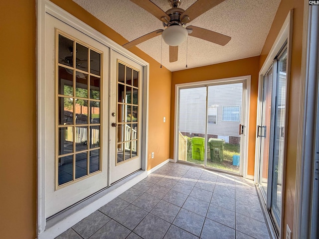 10 Mystic Way Dr, Columbia, SC 29229 - unfurnished sunroom with french doors, a textured ceiling, tile patterned flooring, and baseboards
