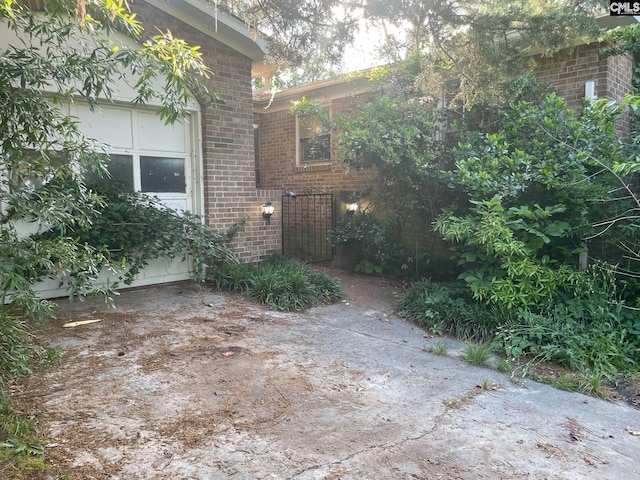 view of side of property with brick siding