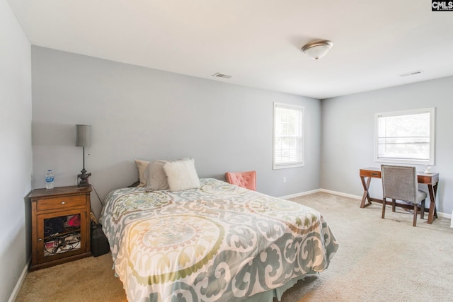 bedroom featuring carpet floors, baseboards, and visible vents
