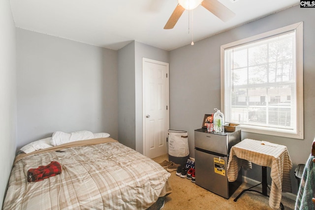 carpeted bedroom featuring a ceiling fan