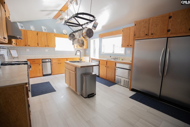 2081 Great N Rd, Winnsboro, SC 29180 - kitchen featuring lofted ceiling, stainless steel appliances, a sink, ventilation hood, and light countertops
