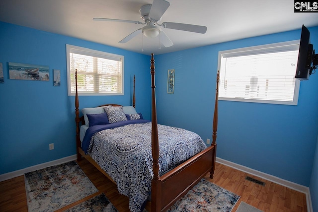 2081 Great N Rd, Winnsboro, SC 29180 - bedroom with a ceiling fan, visible vents, wood finished floors, and baseboards