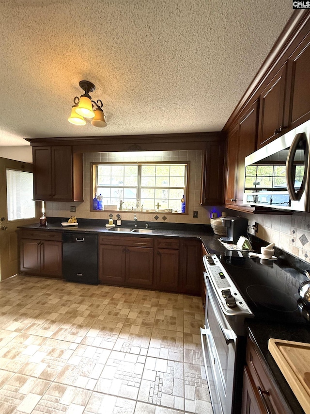 kitchen featuring a textured ceiling, black dishwasher, a sink, stainless steel microwave, and electric stove