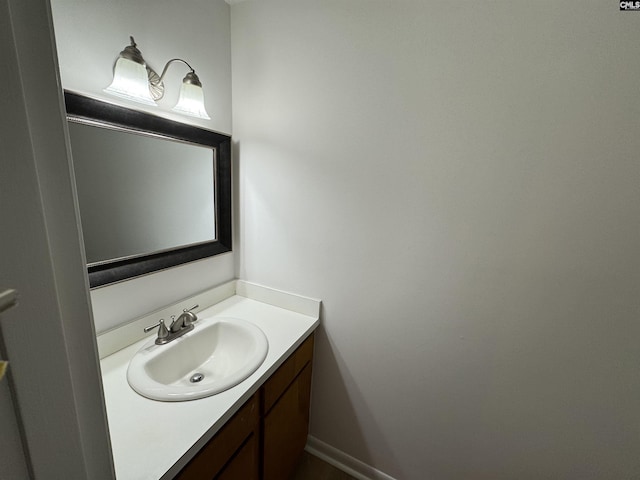 bathroom featuring baseboards and vanity