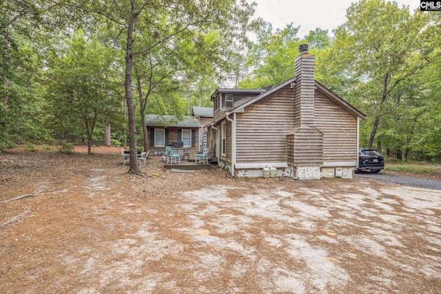 view of home's exterior featuring a chimney