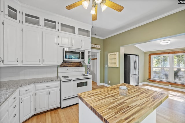kitchen with crown molding, white cabinetry, light wood-type flooring, and appliances with stainless steel finishes