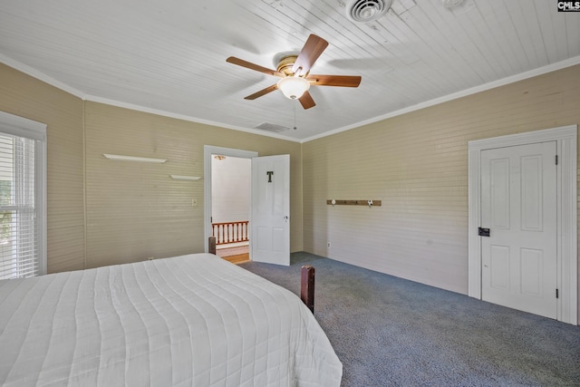 bedroom with visible vents, a ceiling fan, ornamental molding, and carpet floors