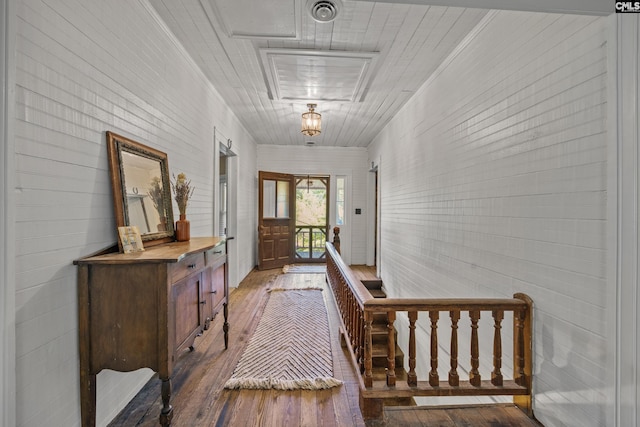 hall with visible vents and wood-type flooring