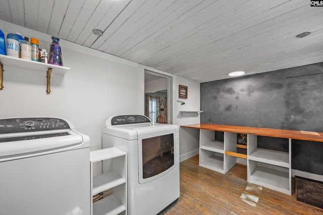 laundry room featuring laundry area, wooden ceiling, washer and clothes dryer, and hardwood / wood-style flooring