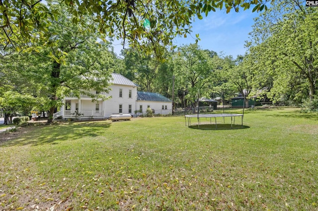 view of yard featuring a trampoline