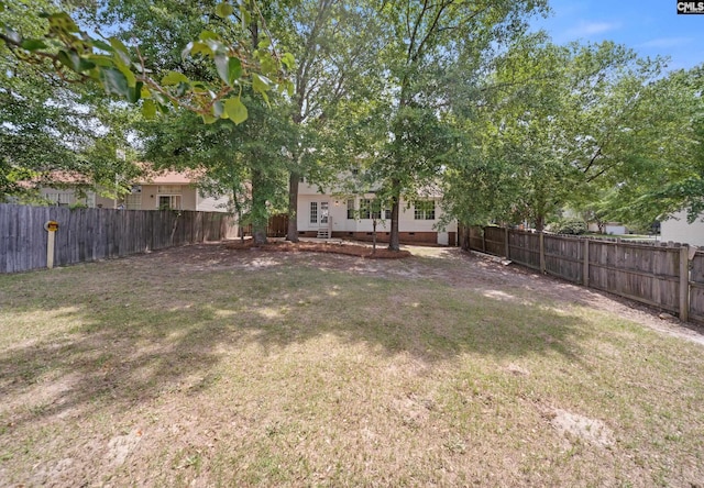 view of yard with a fenced backyard