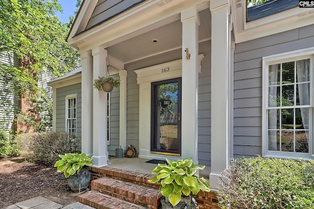 doorway to property featuring covered porch