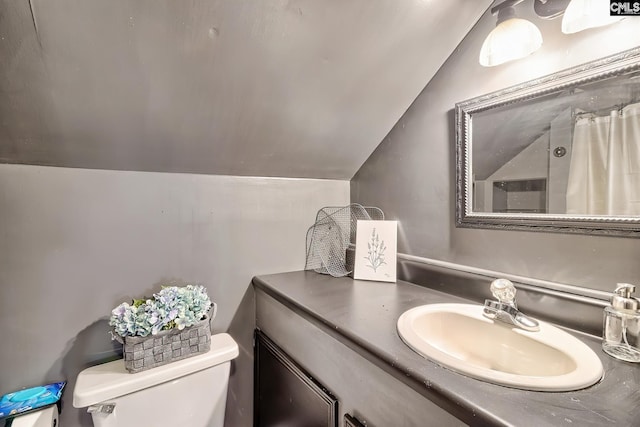 full bathroom with toilet, lofted ceiling, vanity, and curtained shower
