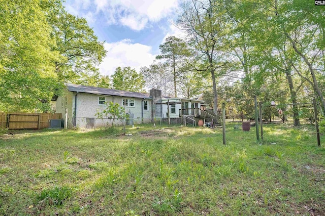 5227 Bush River Rd, Columbia, SC 29212 - view of yard featuring fence, cooling unit, and stairway